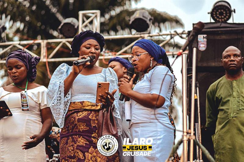 GEH ministers leading worship on the crusade stage